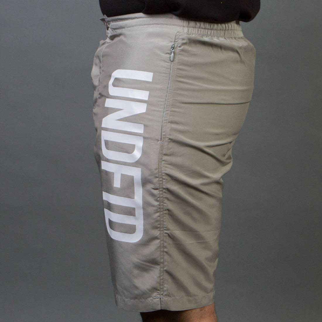 Undefeated swim trunks top